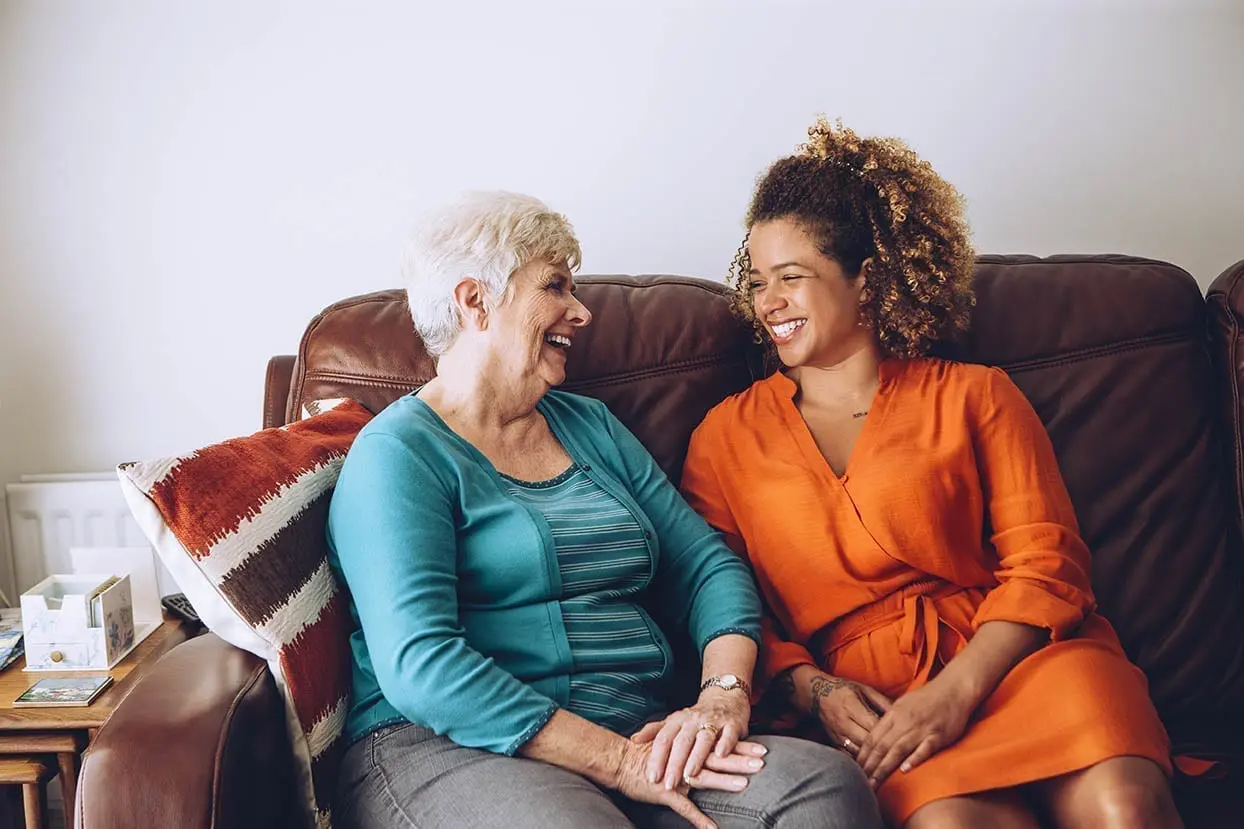 A Greys Home Care caregiver providing compassionate companionship in a senior's familiar home setting