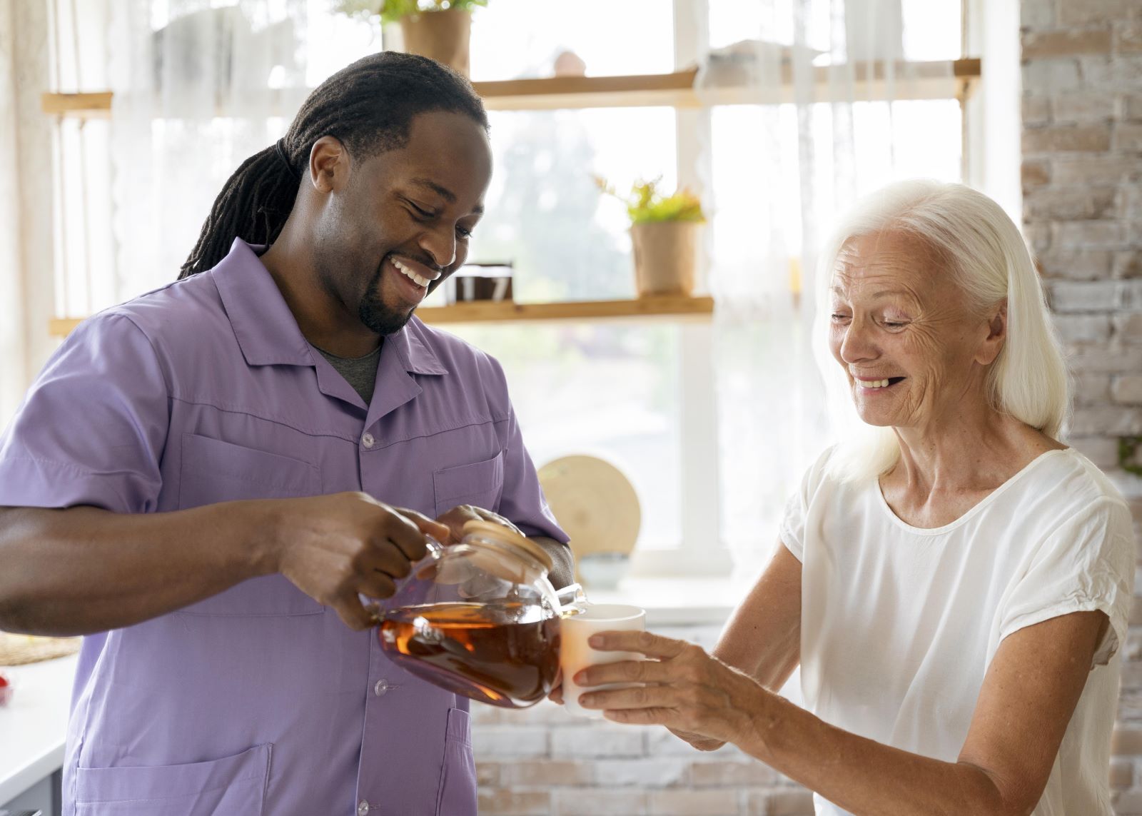 Greys Home Care social worker assisting an elderly woman, representing trust and transparency