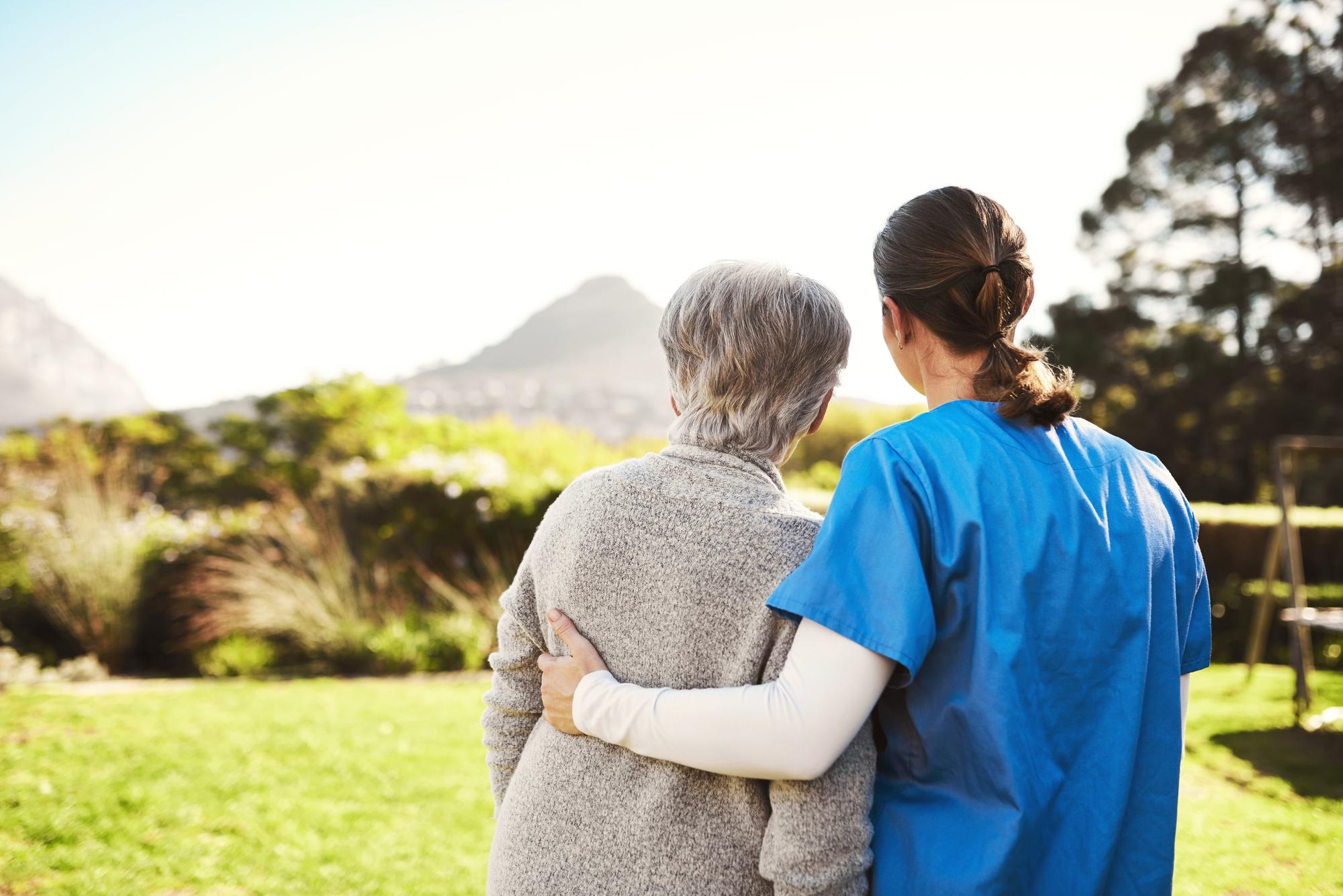 Caregiver and elderly client enjoying time together outdoors in Connecticut